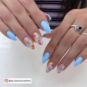 Sky Blue Gel Nails With Flowers On Two Fingers