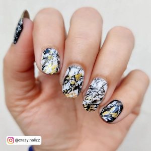 White Nails With Black Marble And Gold Touch