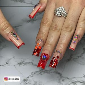 White Nails With Red Heart On Ring Finger