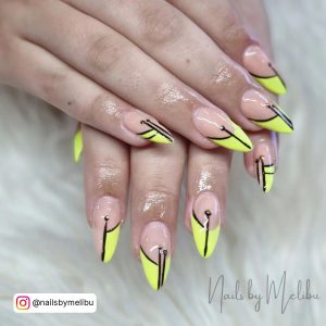 Yellow And Black French Tip Nails With Nude Base Coat