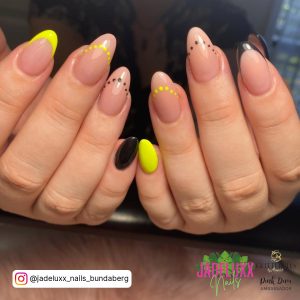 Yellow And Black Gel Nails With French Tip Design