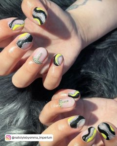 Yellow And Black Marble Nails With Embellishments