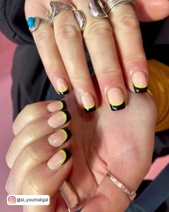 Yellow And Black Nail Art With French Tips