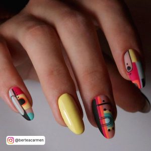 Yellow And Black Nail Art With Unique Design