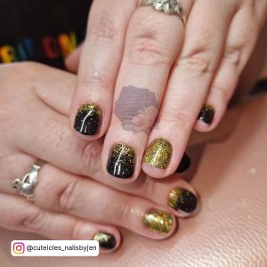 Black And Gold Glitter Ombre Nails