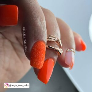 Black And Neon Orange Nails
