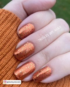 Black And Orange Glitter Ombre Nails
