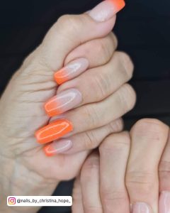 Bright Orange Glitter Nails
