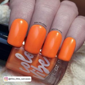 Bright Orange Nails With Glitter