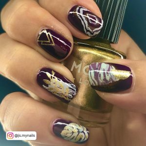 Dark Purple Nails With Gold Glitter