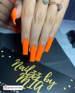 Matte Black And Orange Nails