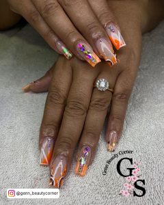 Orange Acrylic Nails With Glitter