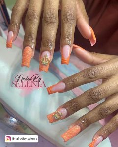Orange And Silver Glitter Nails